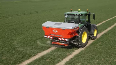 AXIS 40.2 H-EMC-W fertiliser spreader at work