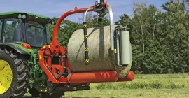 RW 1200 3 point bale wrapper, wraps a round bale at the field.