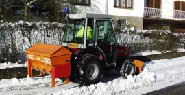 Versatile salt and sand spreader UKS 120 and road maintenance in winter