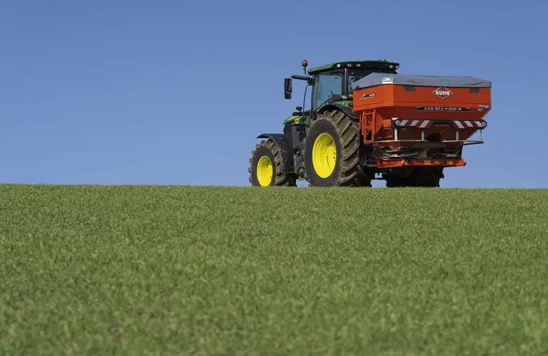 AXIS 40.2 H-EMC-W fertiliser spreader at work