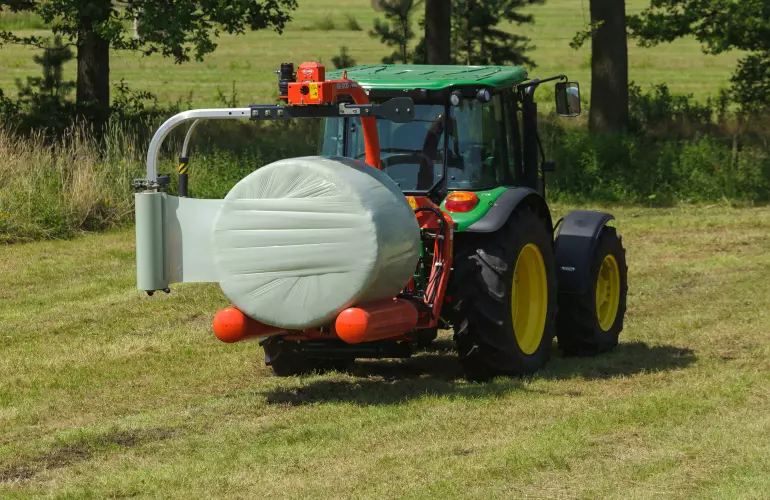 RW 1200 3 point bale wrapper, wraps a round bale at the field.