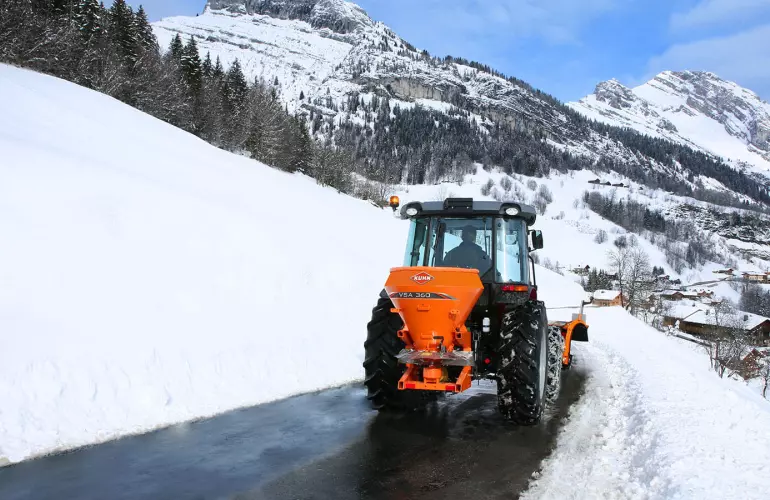 VSA salt and sand spreader at work on mountain roads in the snow
