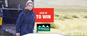 Banner with lady in ridgeline coat leaning on landrover in field