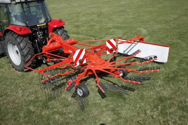 Wheels are positioned extremely close to the tine arms for improved ground following