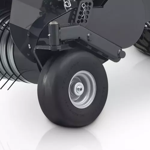 Pivoting semi-pneumatic pick-up guide wheels allow the pick-up to adapt to changing field conditions resulting in less wheel and tire stress.