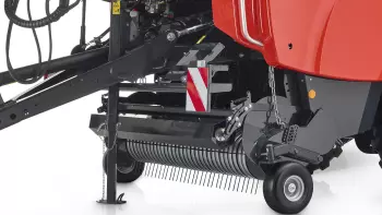 A wide cam-steered pick-up with heavy crop roller with a wind guard.