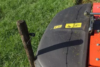 On encountering any obstacles, the material of the side cover bends, without breaking or damaging the mower.