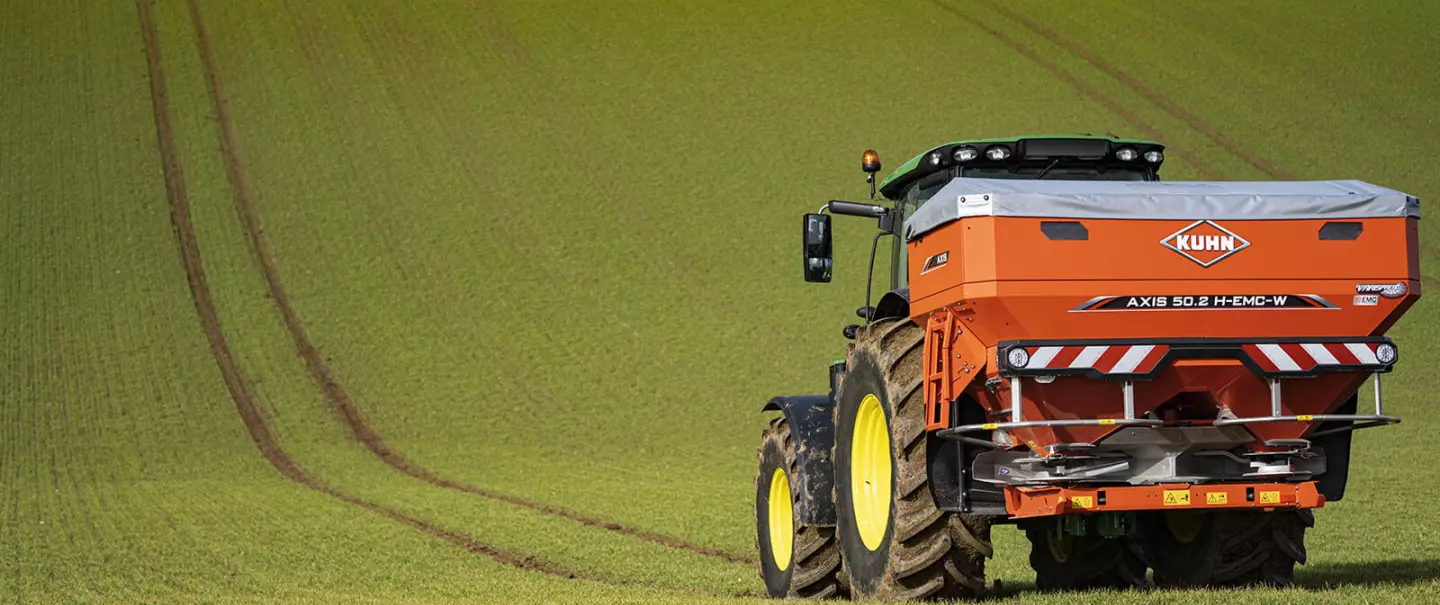 AXIS 50.2 H-EMC-W fertiliser spreader at work