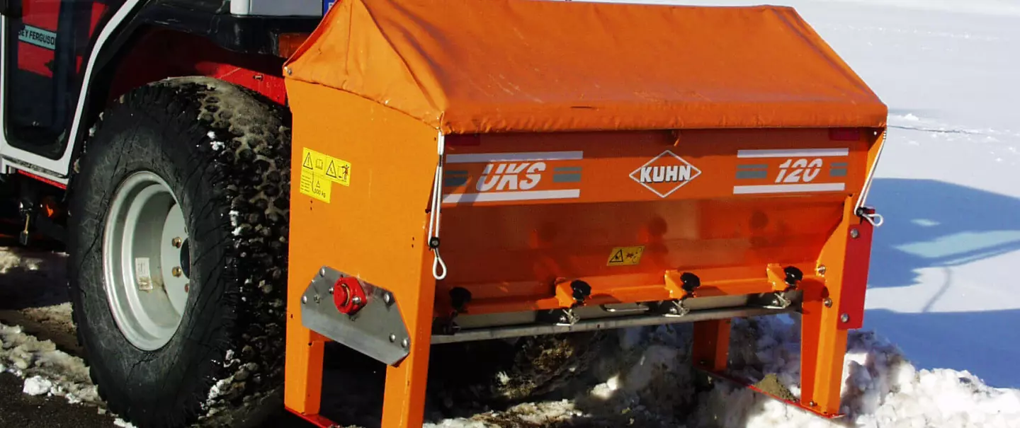 Versatile salt and sand spreader UKS 120 and road maintenance in winter