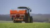 AXIS 40.2 fertiliser spreader in a wheat field