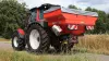 MDS 20.2 fertiliser spreader on the road with a Lindner tractor