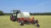 KUHN RW 1410 self-loading round bale wrapper at work